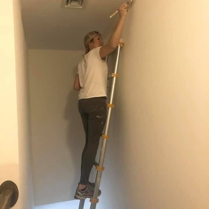Roll With It team member ready for a painting project
