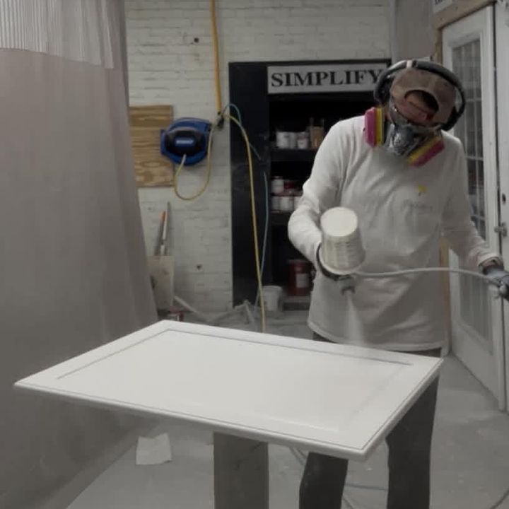 Roll With It painter applying a specialty finish