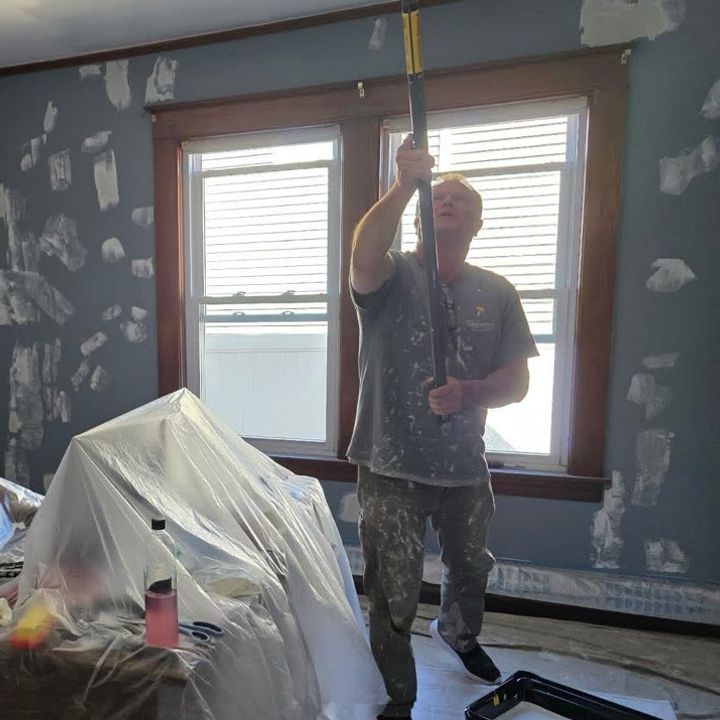 Roll With It painter working in a protected room