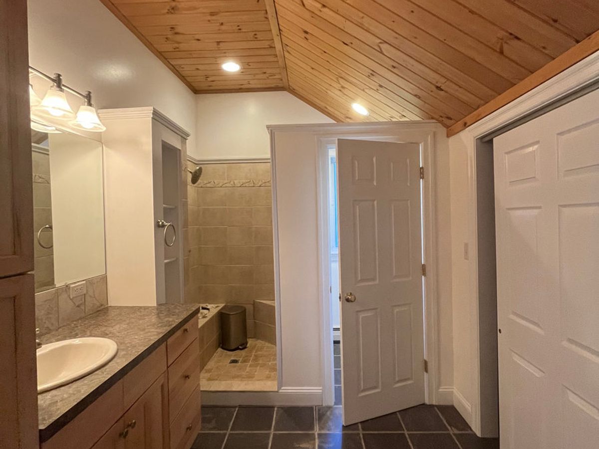 Bathroom vanity and tiled floor