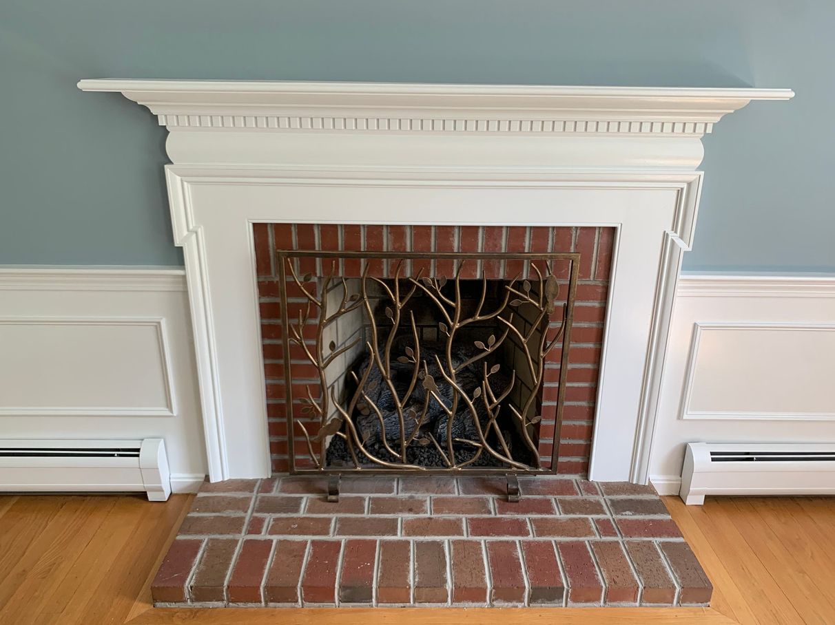 Fireplace and surrounding brick before painting, comparison 4