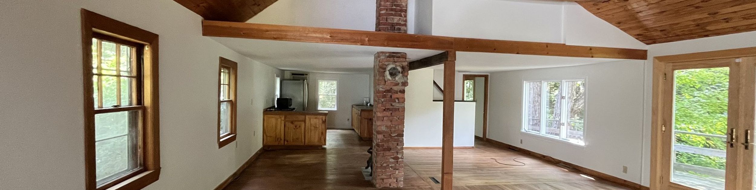 Warm interior with exposed wood beams and fresh paint