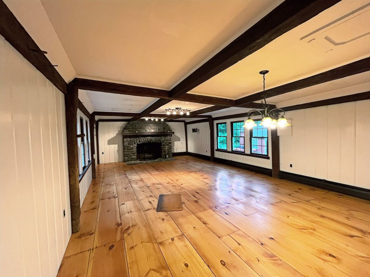 Rustic living room with painted beams and walls